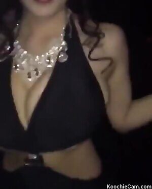 Hitomi Tanaka bouncing around at a club.
