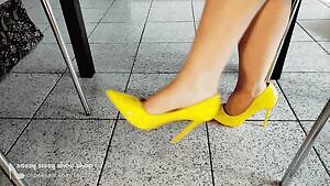 Yellow heels dangling shoeplay