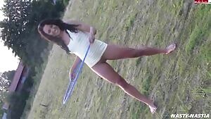 brunette girl peeing while hula hooping