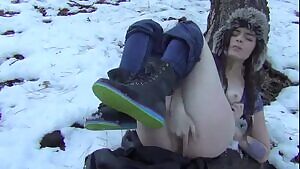 Cute girl masturbates on snow