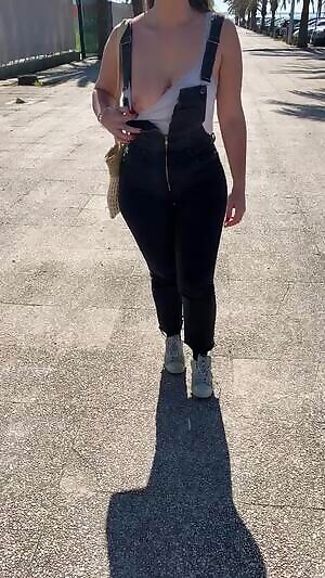 Shy showing one boob while walking