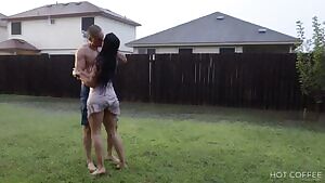 Romantic sex outdoor during heavy rain