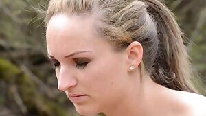 Melania pooping outside in the grass