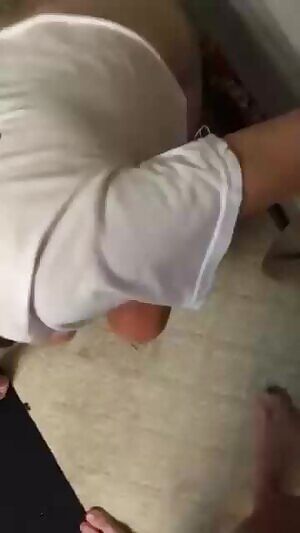 Getting on her knees and gagging on his cock