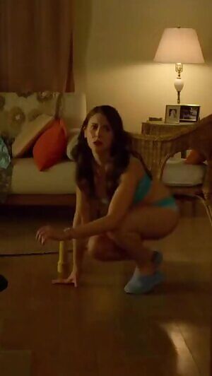 Alison Brie running to call 911.