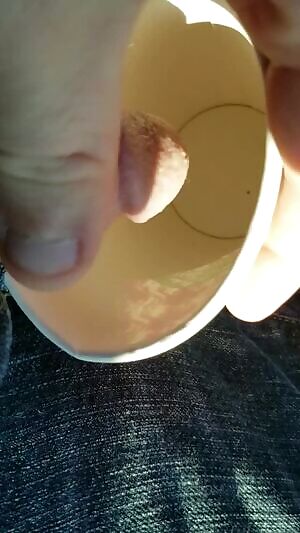 Peeing in a cup in y car