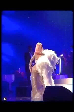 Playing with her ass on stage