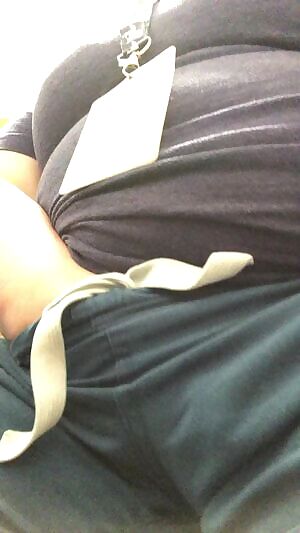 Naughty nurse can’t keep her hands out of her pants at the desk