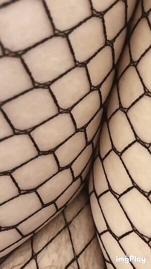 Revealing my fishnet covered pussy